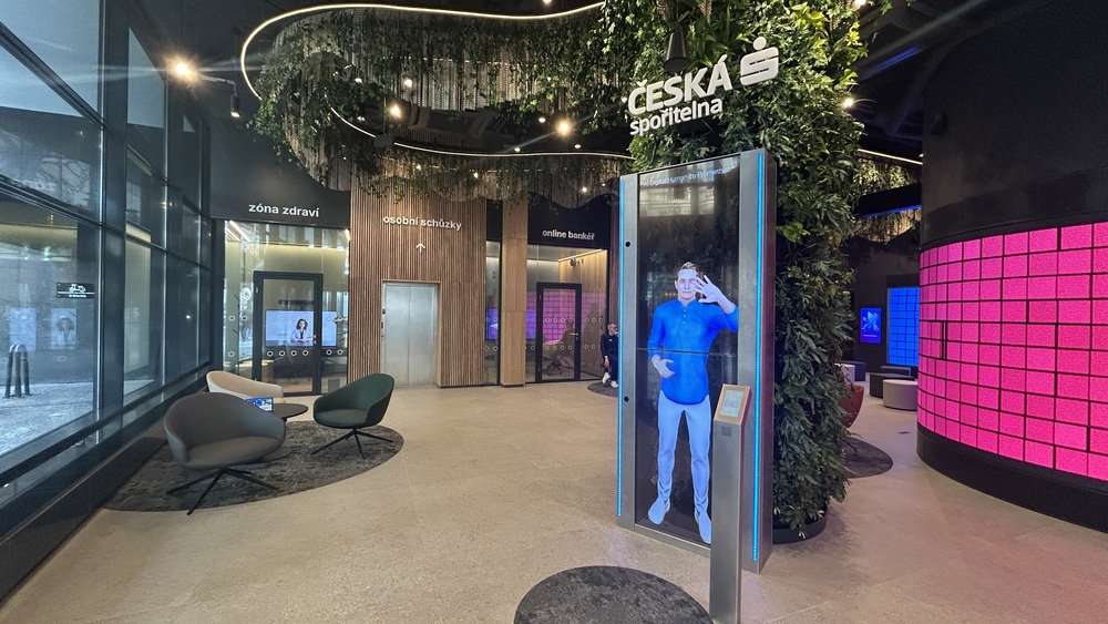 Česká spořitelna Future Lab — the Promethist Engage digital human kiosk in the banking hall at Na Perštýně, Prague