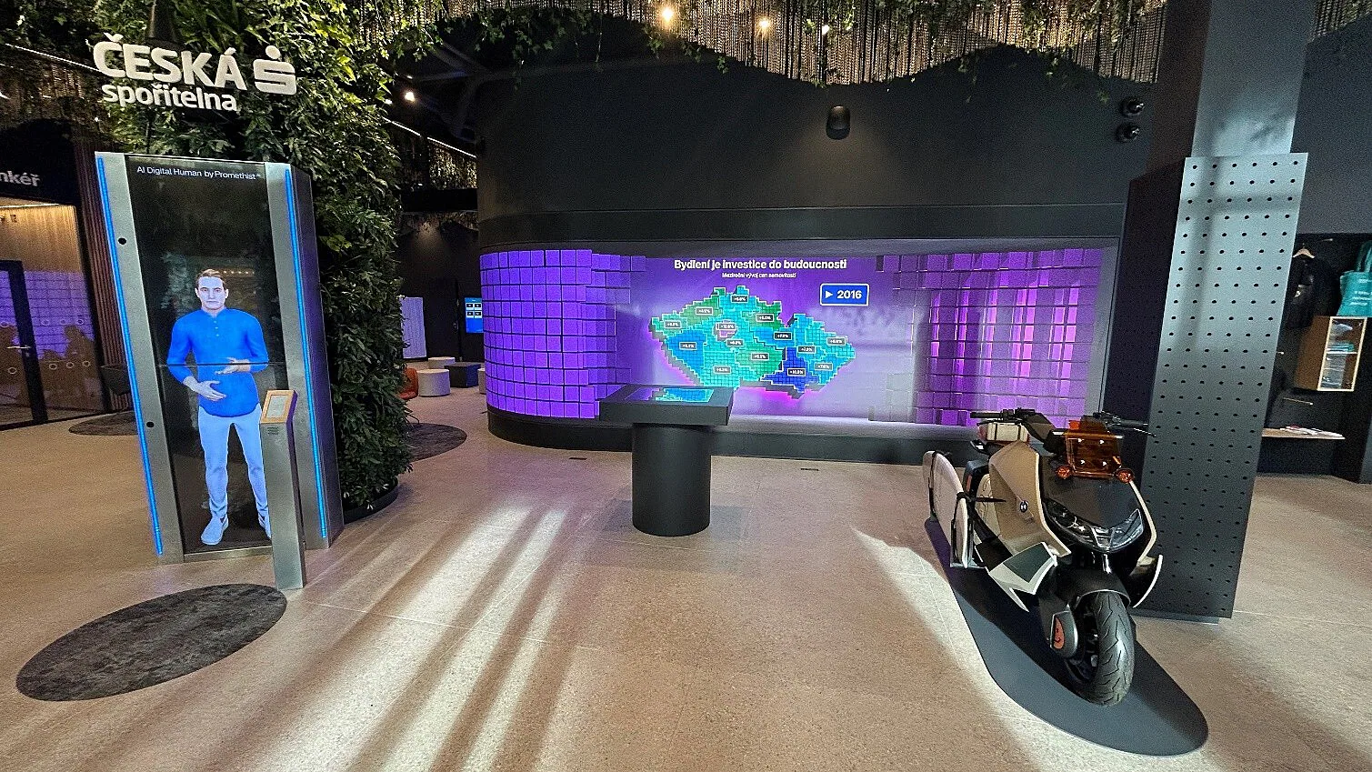 Future Lab interior — kiosk, curved LED wall displaying Czech real-estate data, and open space